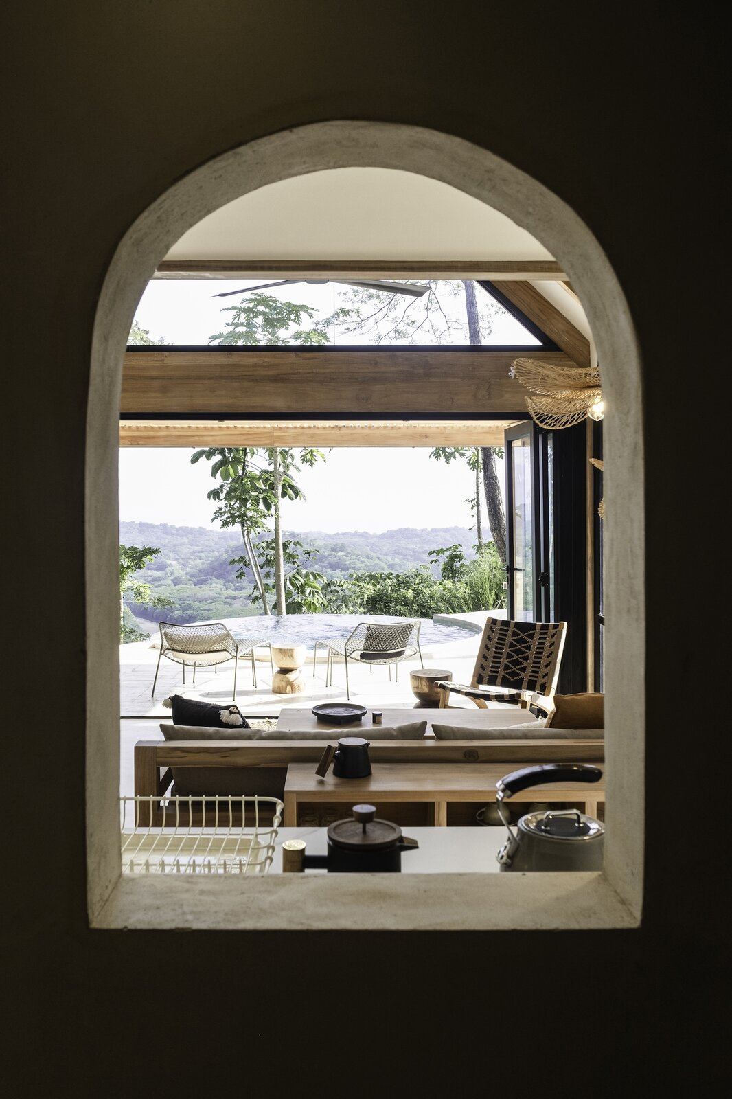Dining and living area beneath timber beams