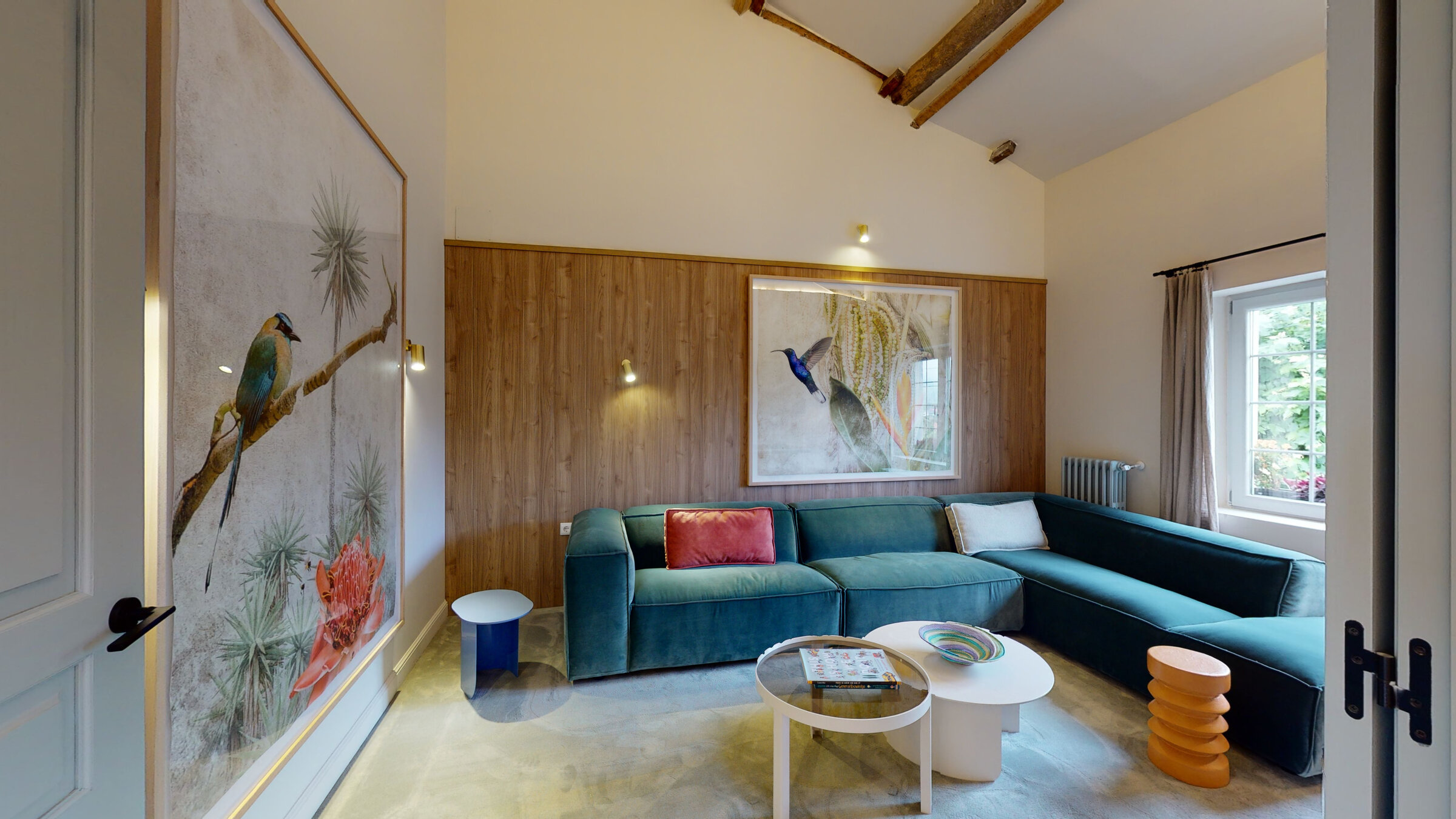 Bedroom seating area beneath wood beams